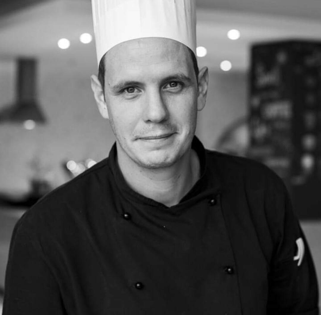 Chef in Clothes with a chefs hat